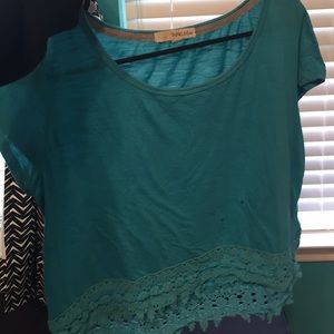 A turquoise flowy top